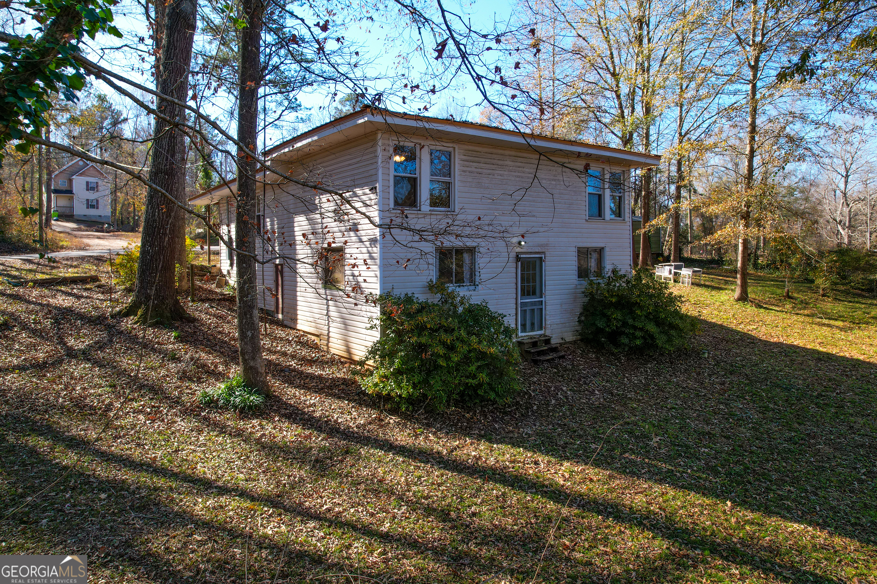 139 Cherokee Drive Jackson, GA 30233 - Photo 23 of 34 a front view of a house with garden