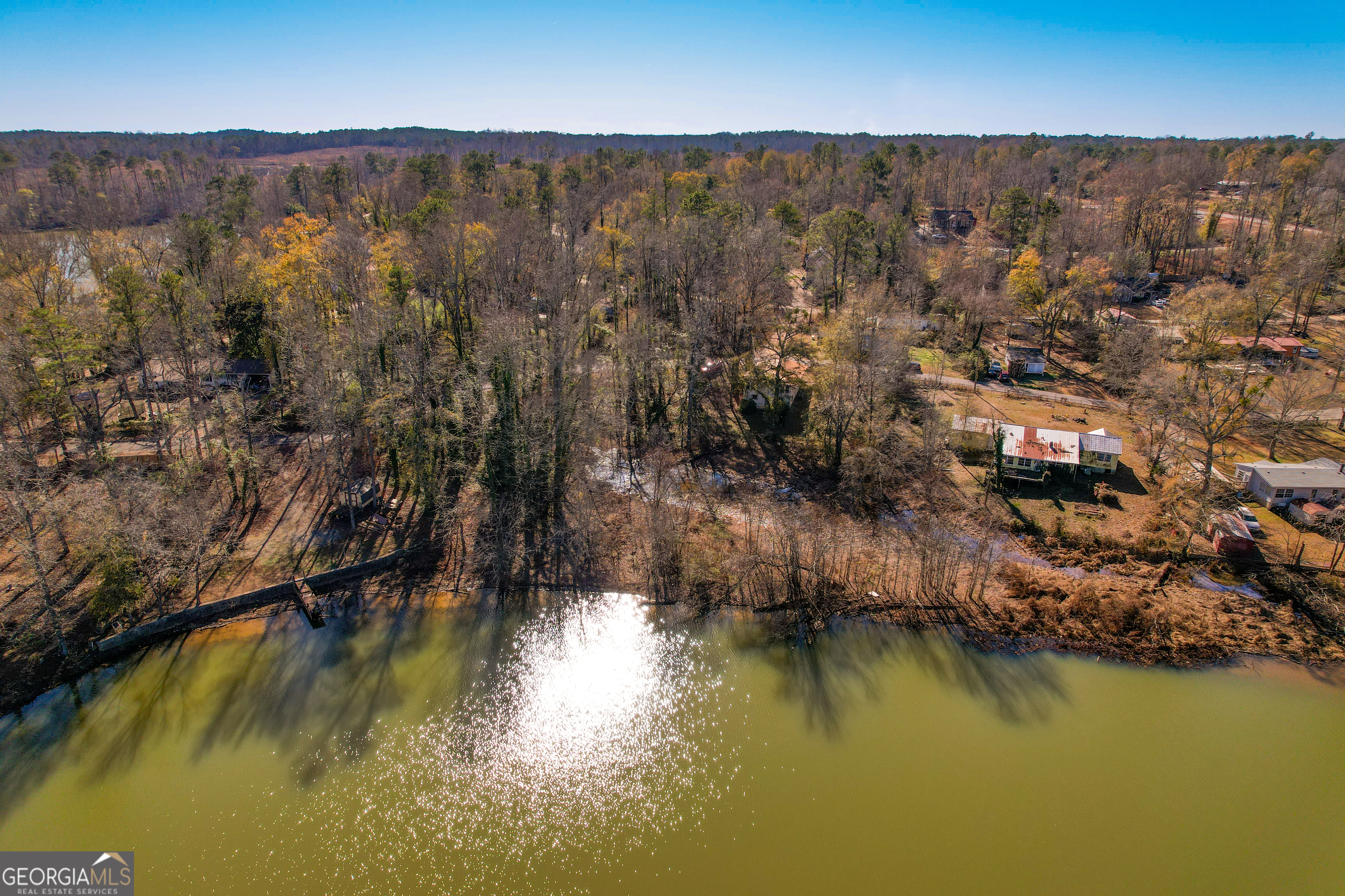 139 Cherokee Drive Jackson, GA 30233 - Photo 33 of 34 an aerial view of residential houses with outdoor space and lake view