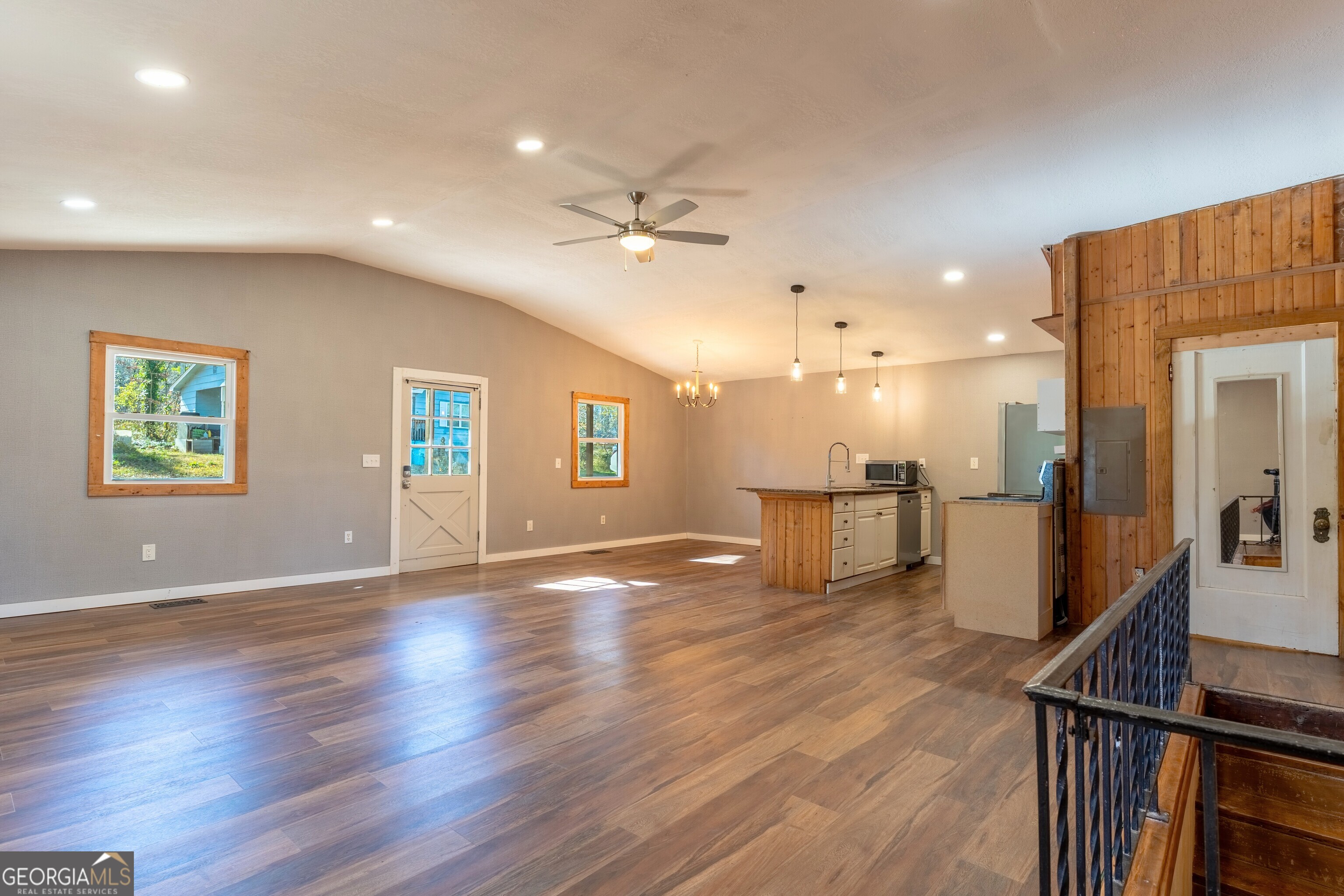 139 Cherokee Drive Jackson, GA 30233 - Photo 7 of 34 a view of a livingroom with furniture a ceiling fan and wooden floor