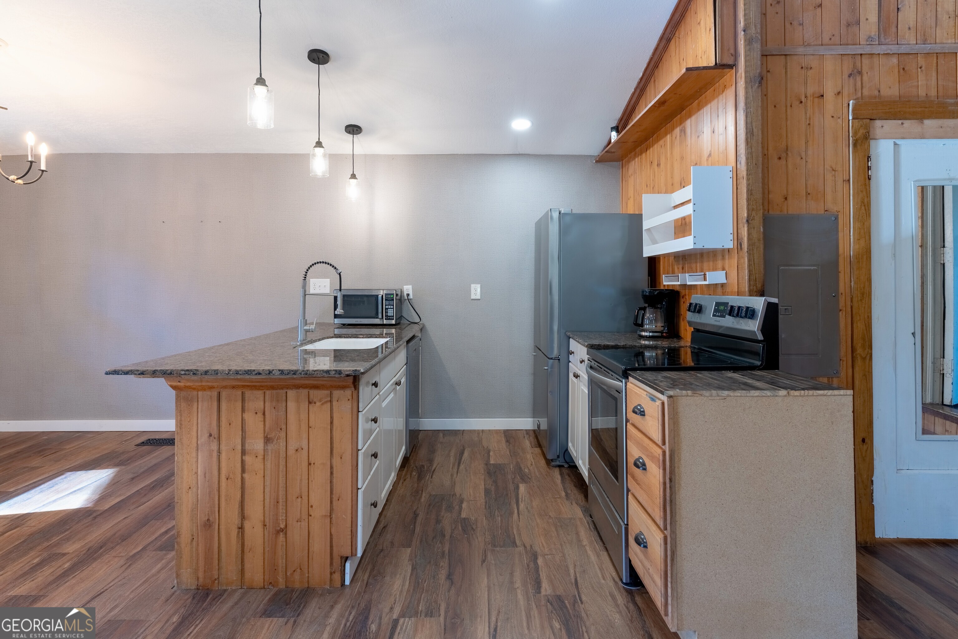 139 Cherokee Drive Jackson, GA 30233 - Photo 8 of 34 a kitchen with granite countertop a refrigerator a sink and wooden floor
