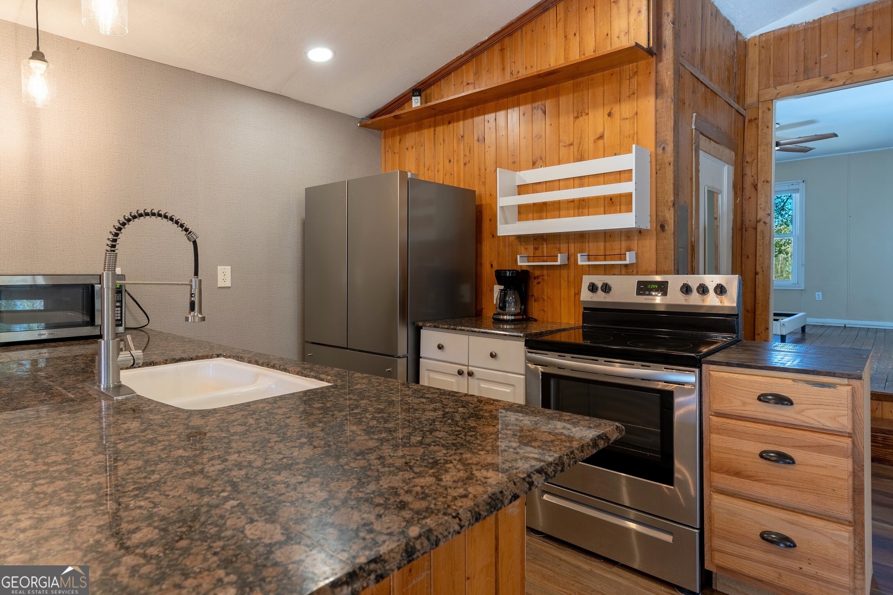 139 Cherokee Drive Jackson, GA 30233 - Photo 10 of 34 a kitchen with stainless steel appliances granite countertop a stove a sink and a refrigerator