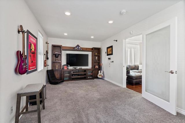 a kitchen with counter top space appliances and windows