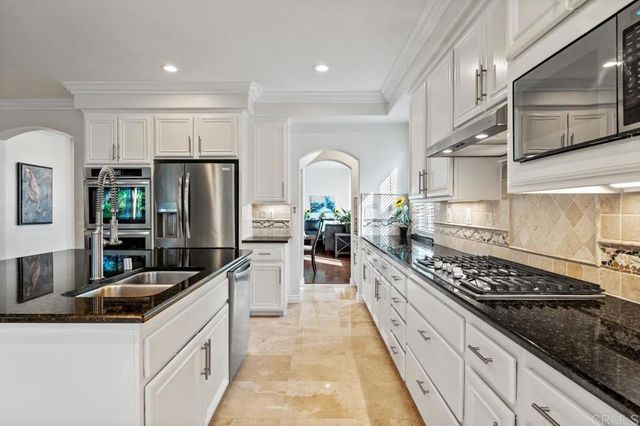 a view of entryway livingroom and hall with wooden floor