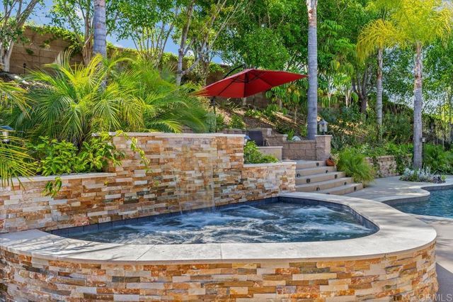 a bathroom with a double vanity sink and a toilet