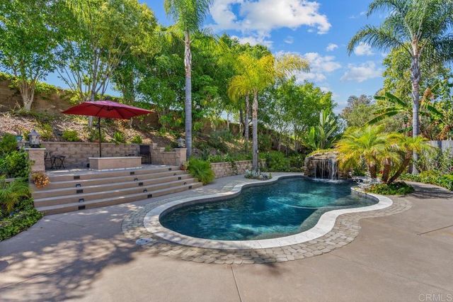 a bathroom with a granite countertop sink mirror and a