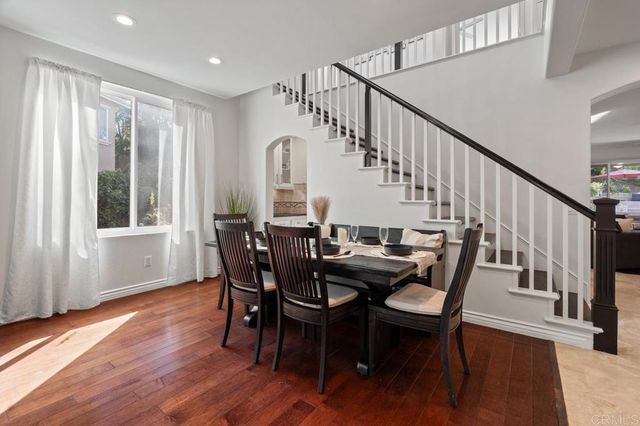 a view of a livingroom with entryway and furniture