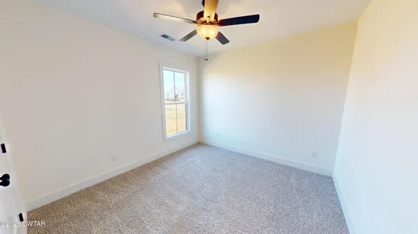 a view of a bathroom with a sink and mirror