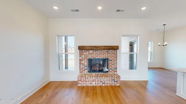 a view of kitchen with sink microwave and stove