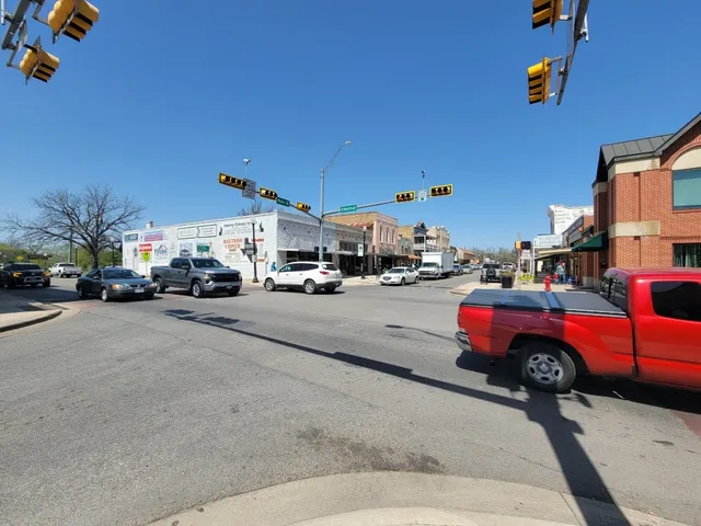 a view of the city street with cars