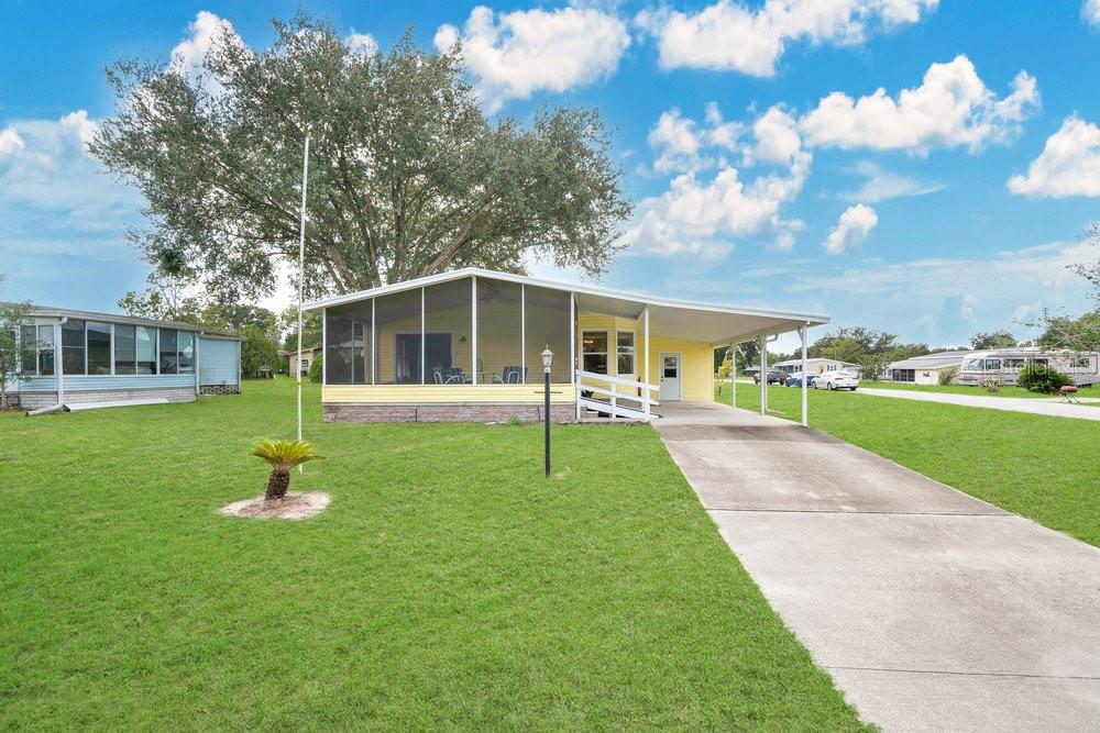 152 Florence Boulevard DeBary, FL 32713 - Photo 1 of 1 a house with green field in front of it
