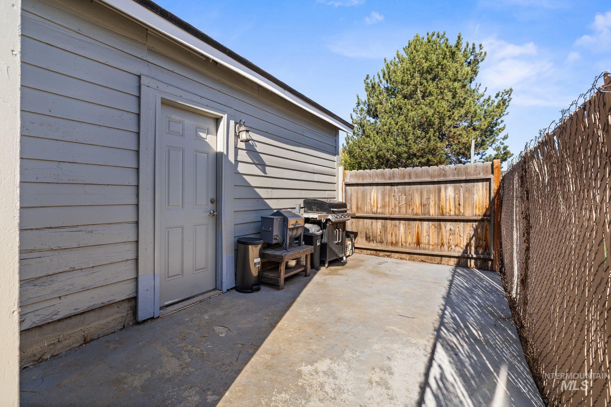 1504 2nd Street North Nampa, ID 83687 - Photo 28 of 29 Fenced backyard with a grill and a patio area