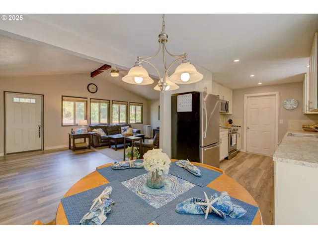 a view of a living room and kitchen