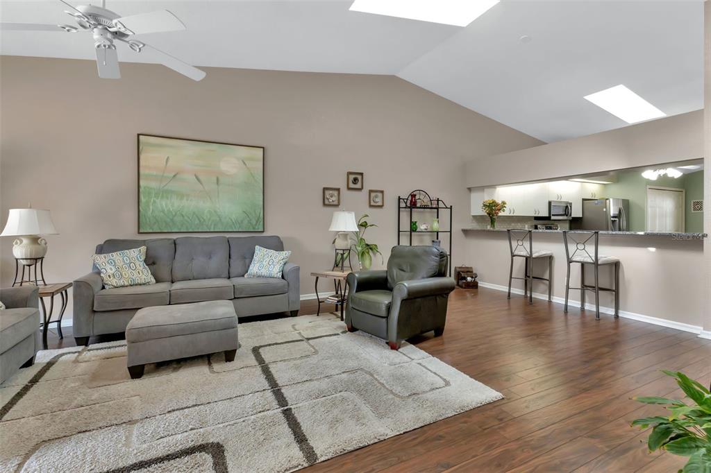 5036 San Rocco Court Punta Gorda, FL 33950 - Photo 11 of 13 a living room with furniture and wooden floor