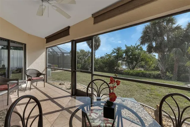 a view of a floor to ceiling window and wooden floor
