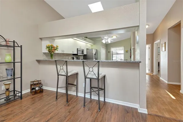a view of a kitchen and dining room
