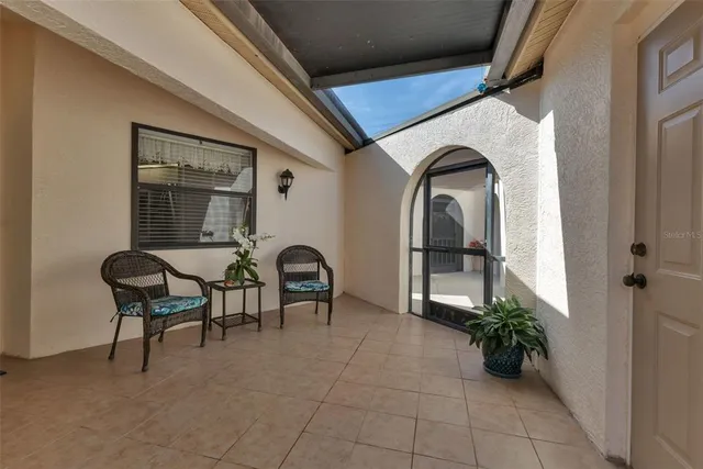 a view of swimming pool with outdoor seating