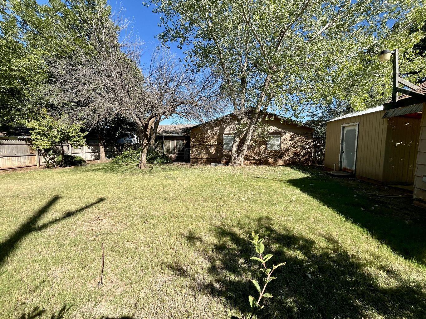 2009 Dallas Plainview, TX 79072 - Photo 20 of 26 a view of a yard with large trees