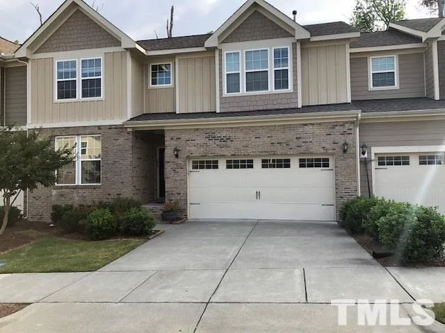 a view of a hallway with wooden floor and stairs