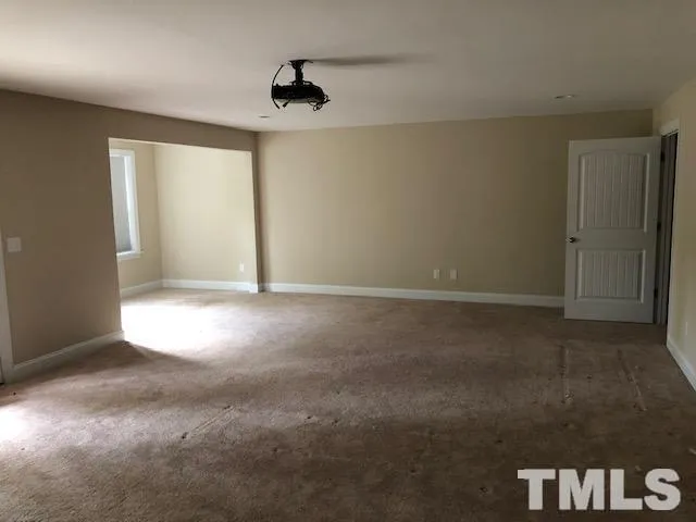 a view of a livingroom with furniture and a ceiling fan
