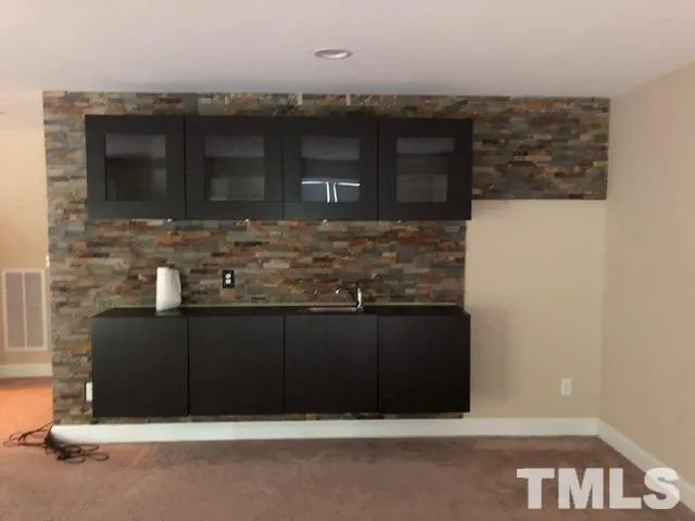 a view of a garden with a small cabin