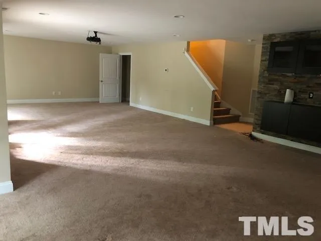 a backyard of a house with a tree