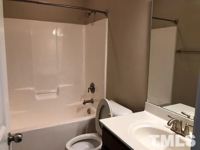a bathroom with a shower and a sink