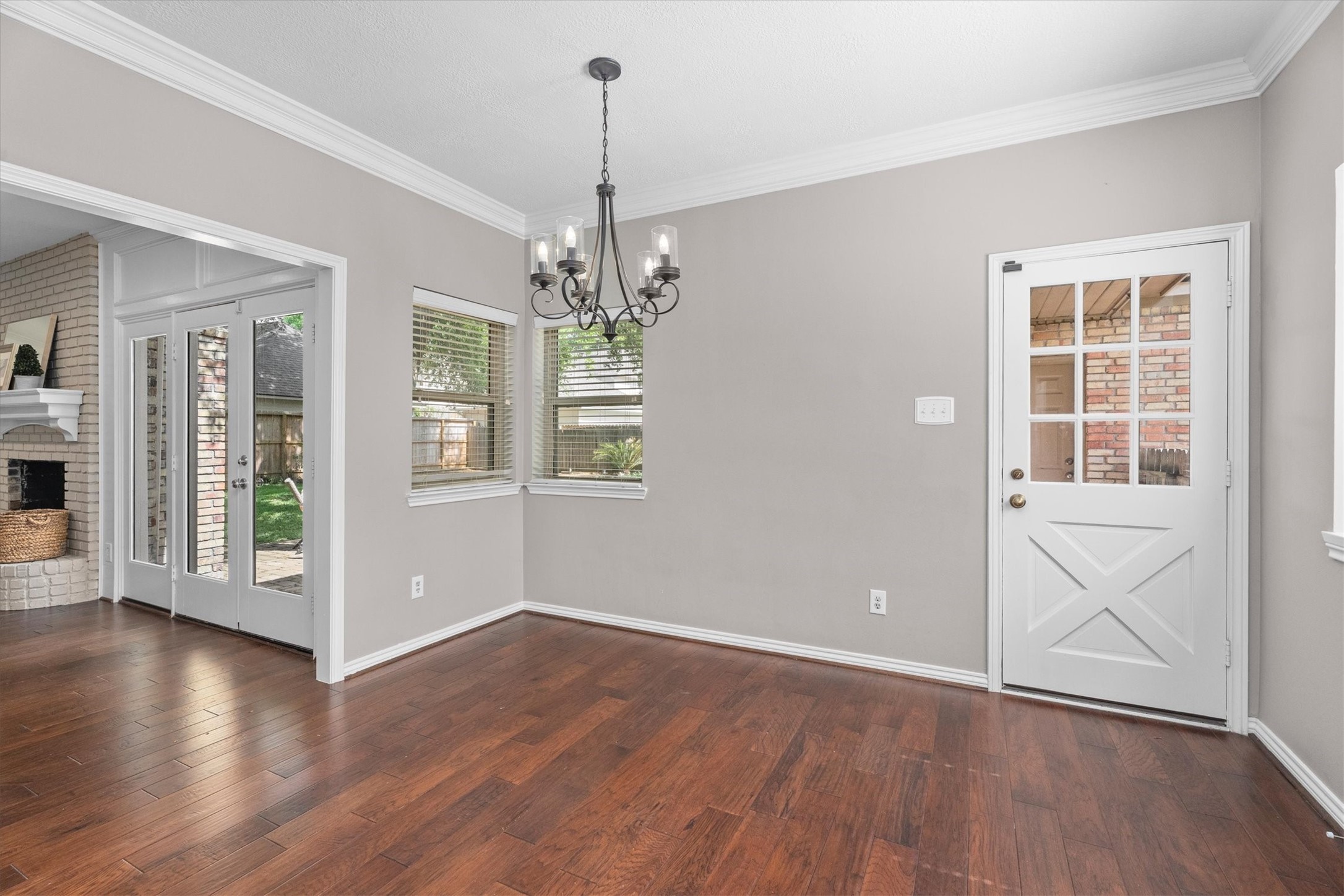 16267 Salmon Lane Spring, TX 77379 - Photo 12 of 48 Updated windows anchor this sunny breakfast room. The back door opens to a covered walkway to the three-car garage.