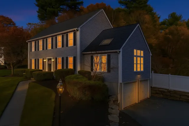 a front view of a house with a yard