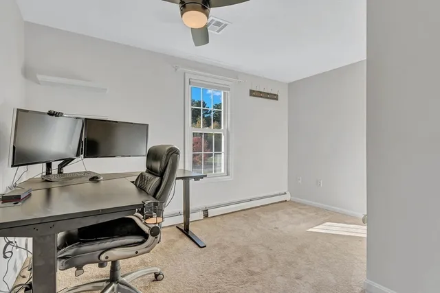 a view of a workspace with furniture