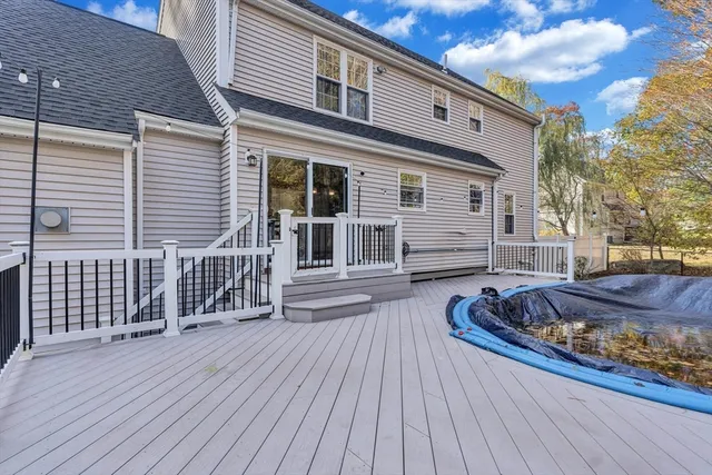 a front view of a house with entryway and wooden floor
