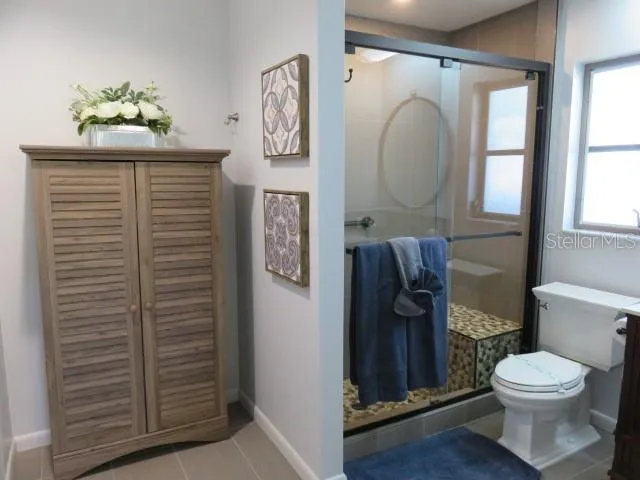 a bathroom with a toilet and a sink