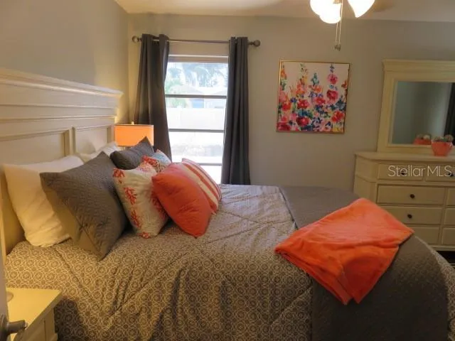 a bedroom with a bed and window