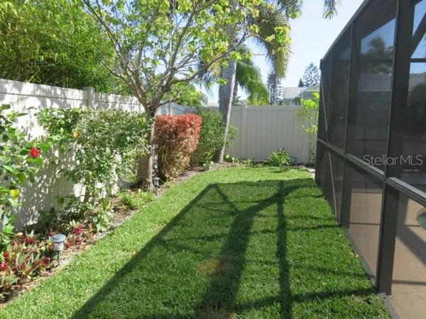 a backyard of a house with lots of green space