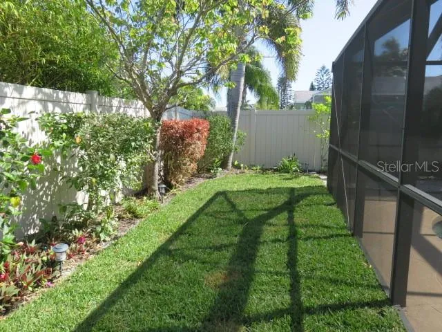 a backyard of a house with lots of green space
