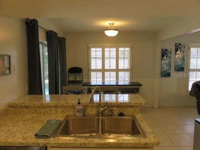 a view of a kitchen with a sink and dishwasher