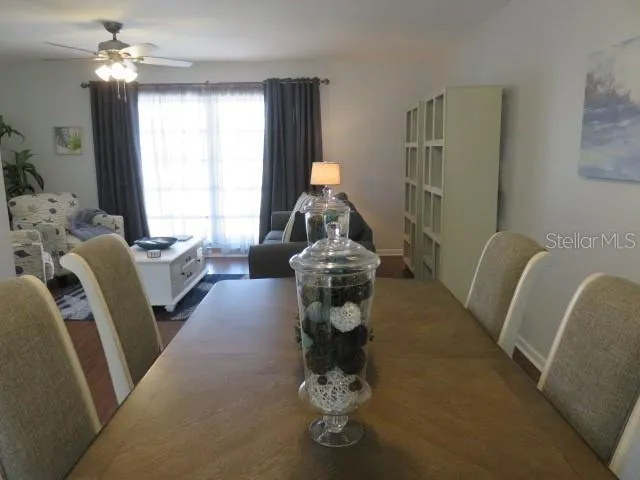 a dining room with furniture and window