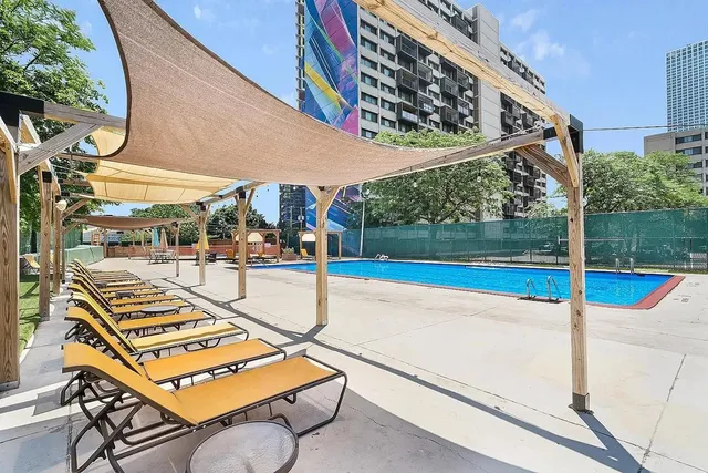 a view of swimming pool with a patio