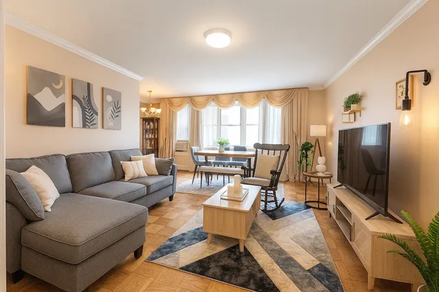 a living room with furniture and a flat screen tv