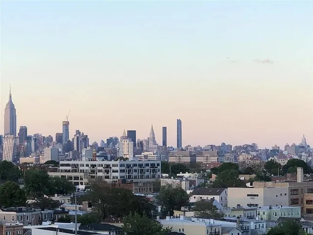 a view of a city with tall buildings