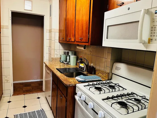 a kitchen with a stove and a microwave