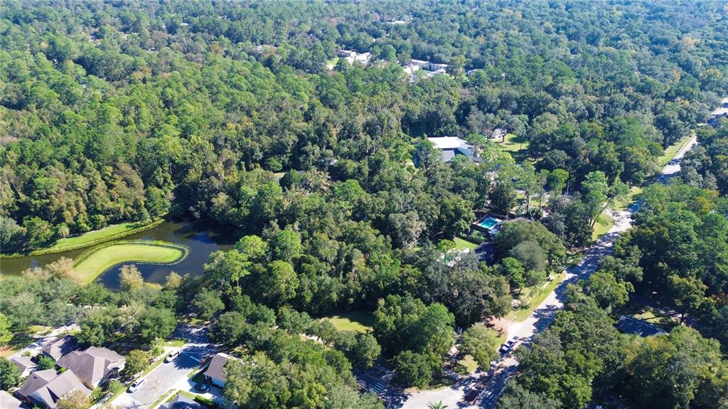 Tbd Northwest 23rd Terrace Gainesville, FL 32605 - Photo 10 of 13 a view of a house with a yard and swimming pool