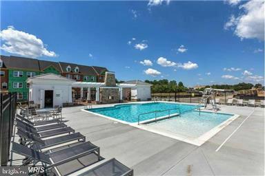 7581 Crowley Street Hanover, MD 21076 - Photo 18 of 19 a view of a house with pool table and chairs