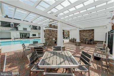 7581 Crowley Street Hanover, MD 21076 - Photo 19 of 19 a view of a dining hall with stainless steel appliances granite countertop a stove and a refrigerator