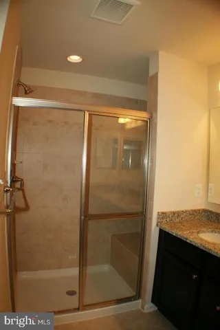 a view of a balcony with wooden fence and floor