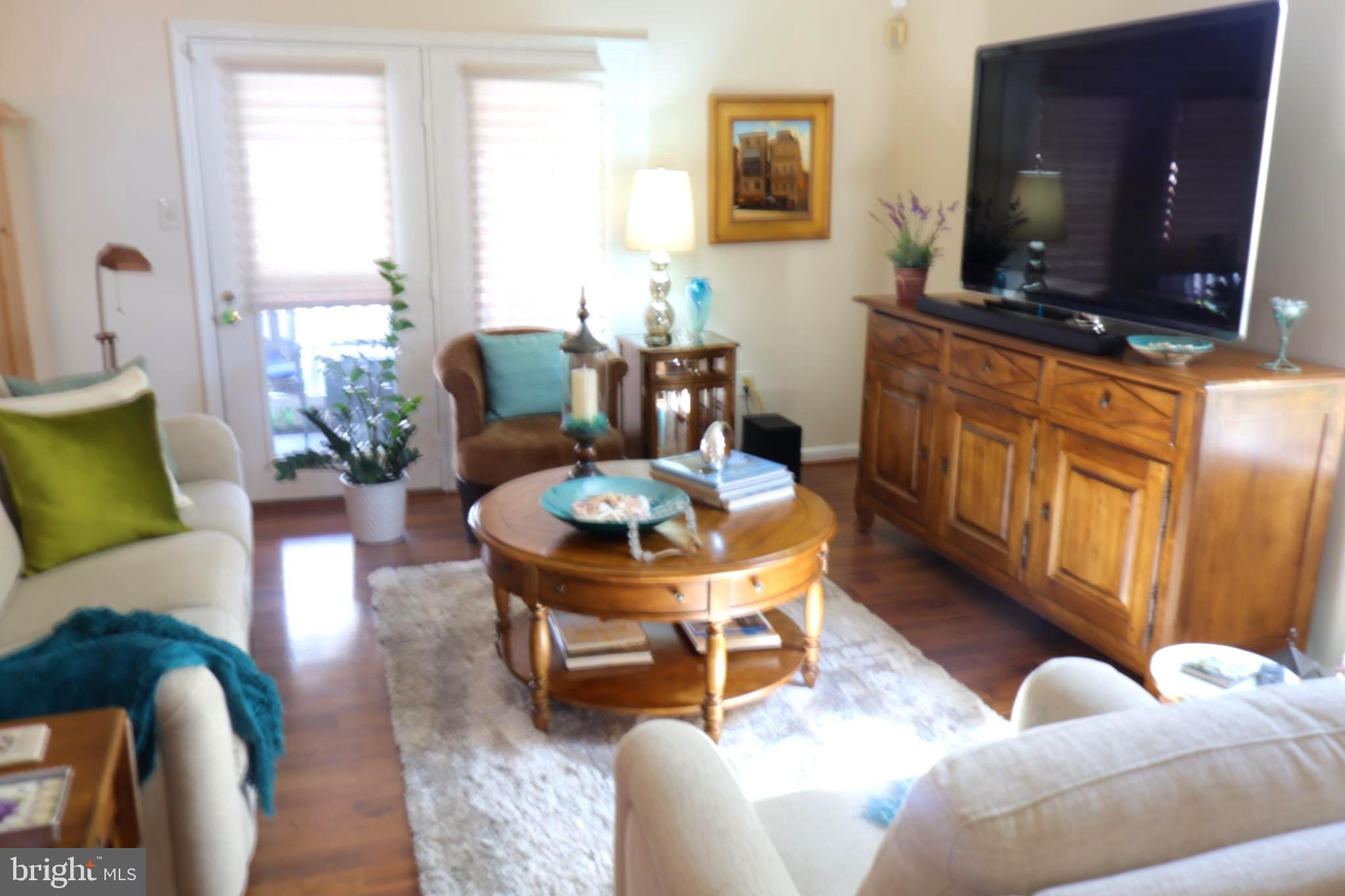 118 Primrose Lane Reading, PA 19610 - Photo 11 of 36 a living room with furniture and a flat screen tv