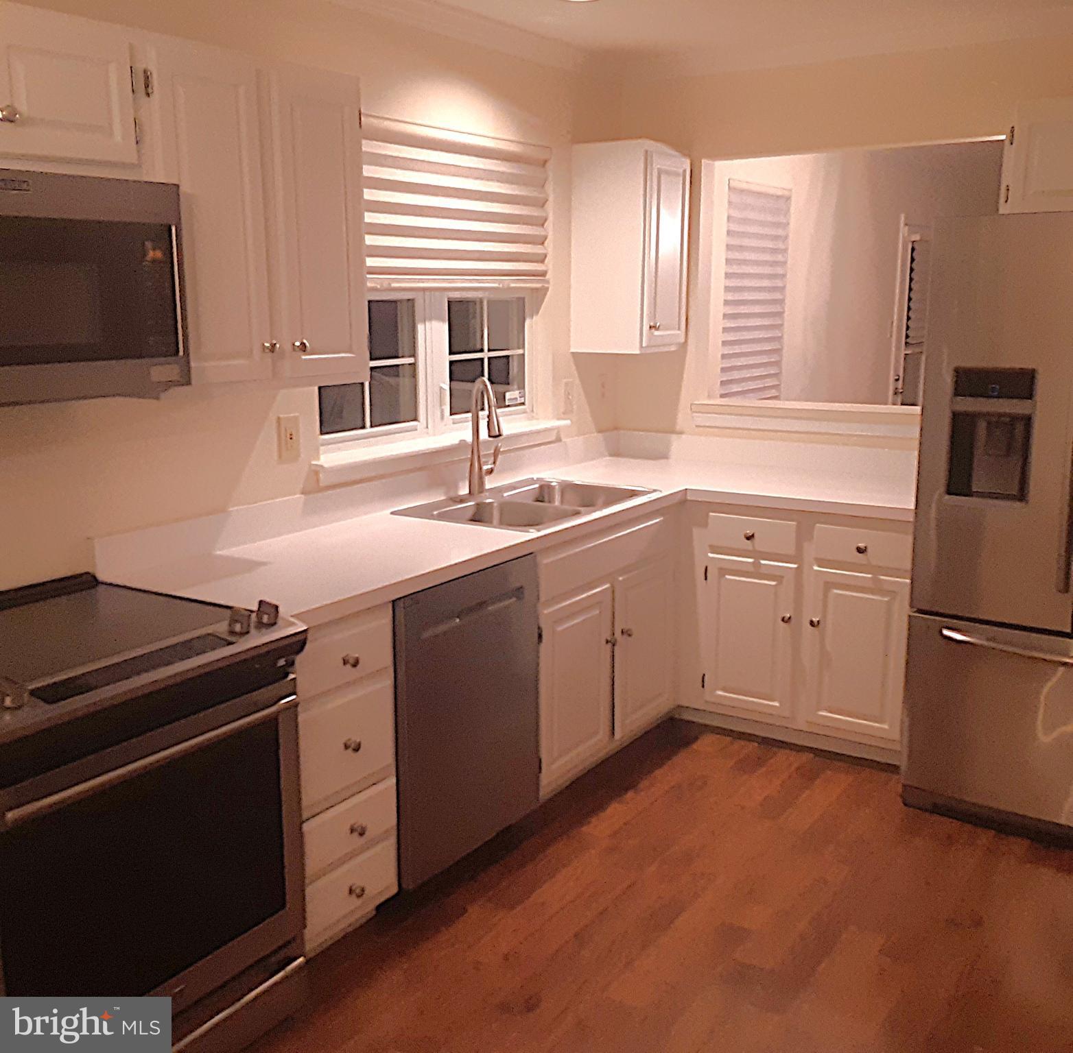 118 Primrose Lane Reading, PA 19610 - Photo 14 of 36 a kitchen with a sink stove and microwave
