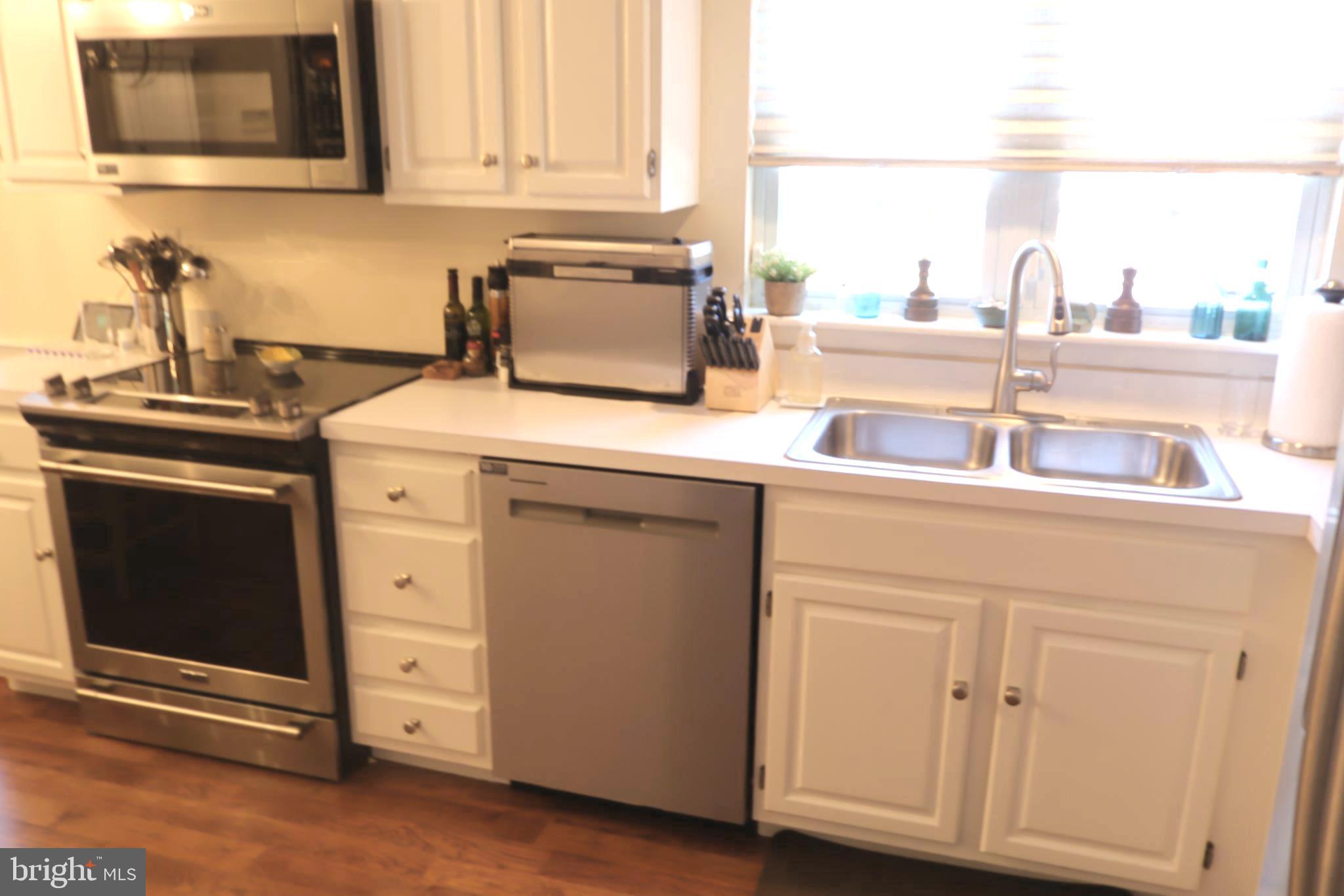 118 Primrose Lane Reading, PA 19610 - Photo 15 of 36 a kitchen with a stove and a microwave