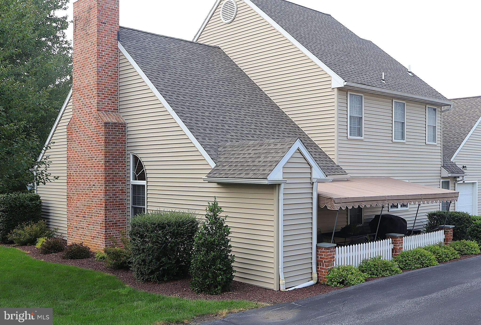 118 Primrose Lane Reading, PA 19610 - Photo 33 of 36 a view of a house with a yard and plants
