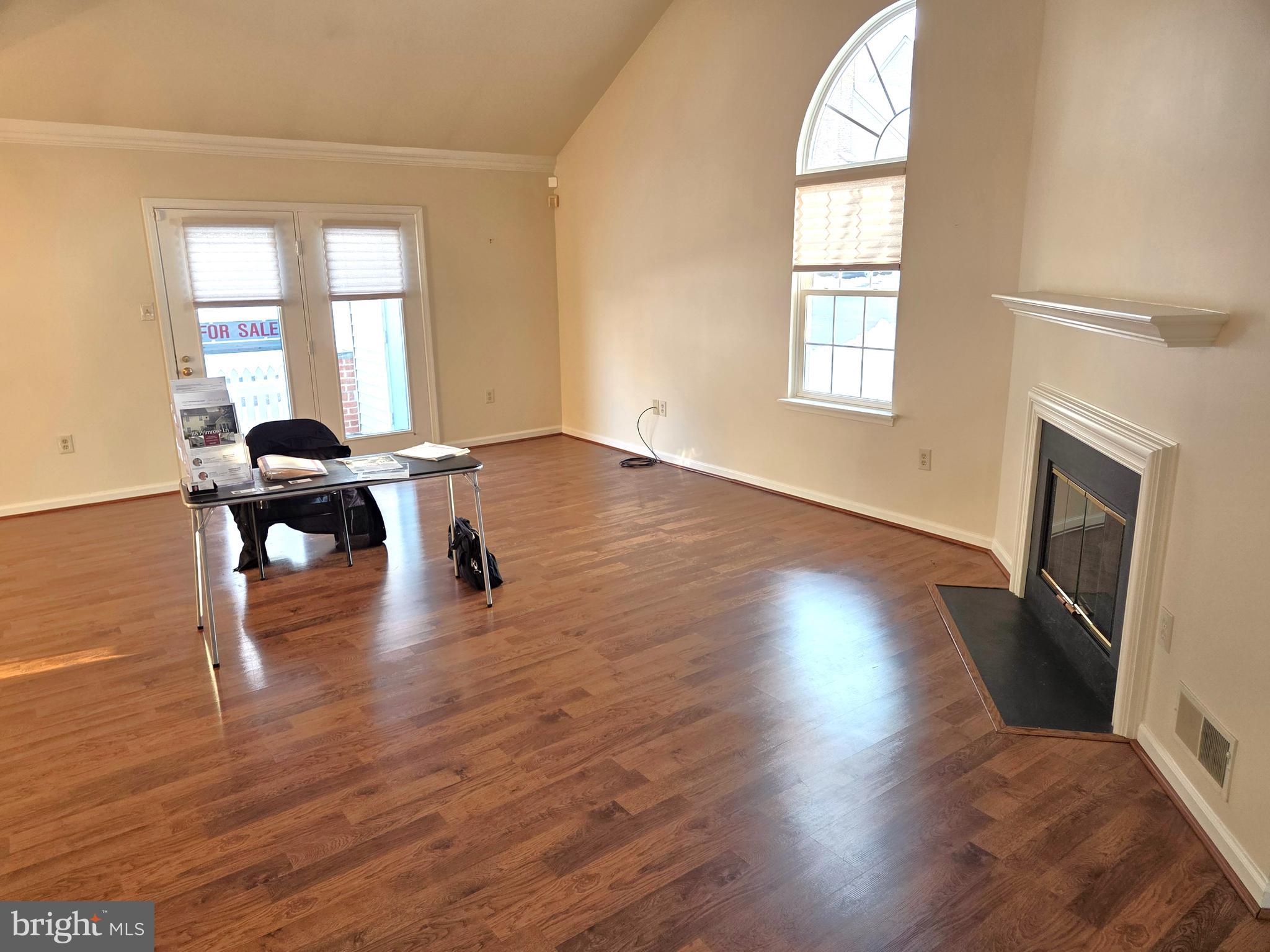 118 Primrose Lane Reading, PA 19610 - Photo 9 of 36 an empty room with wooden floor and windows