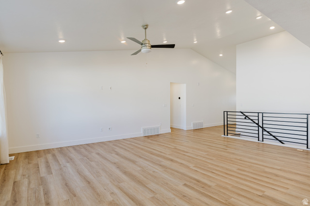 433 North 600 West Smithfield, UT 84335 - Photo 19 of 40 Open-concept living space featuring wood-finish flooring, recessed lighting, a modern ceiling fan, vaulted ceilings, and a contemporary horizontal black metal railing